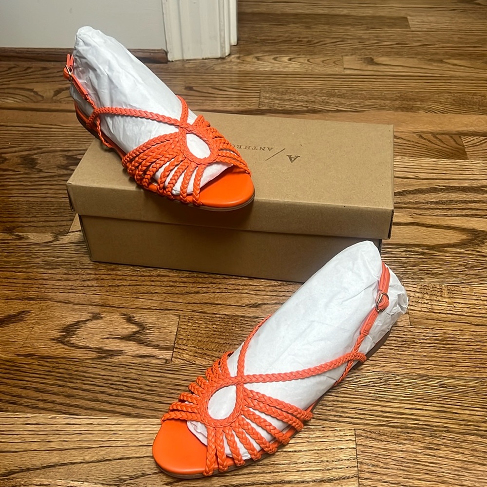Anthropologie strappy orange sandals.